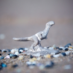 Plastic dinosaur on a plastic landscape